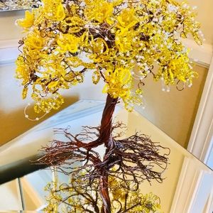 Tree with yellow leaves, flowers